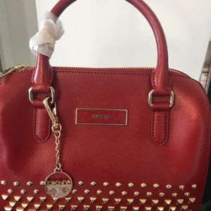 Brand new DKNY handbag with shoulder strap.